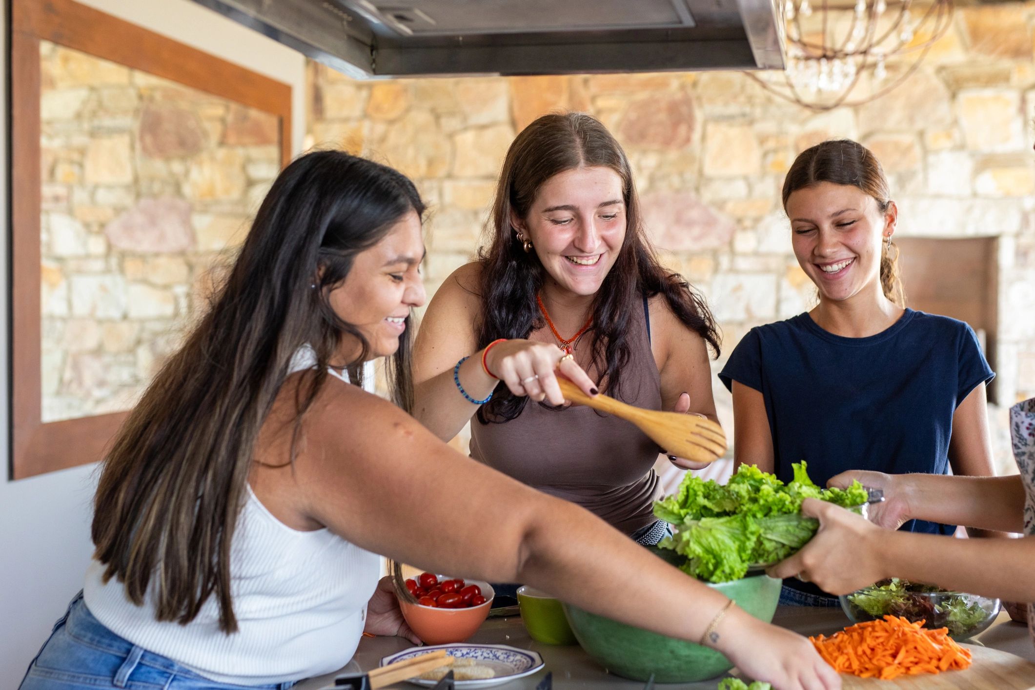 Family-style food preparation in a warm kitchen